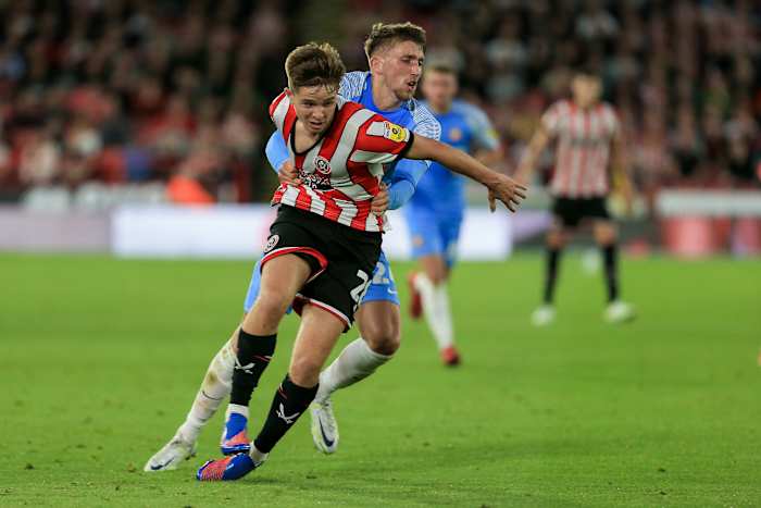 Neil pulling down McAtee after losing possession. 